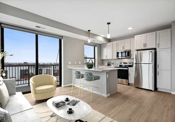 a kitchen and living room with a large window
