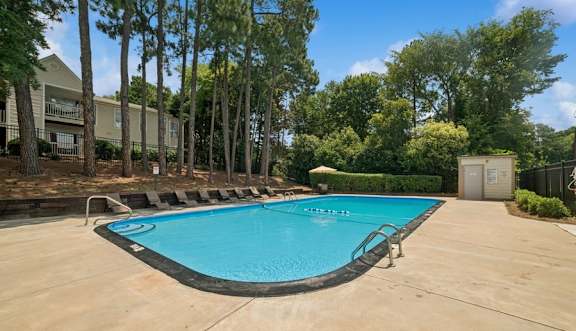 Outdoor pool surrounded by trees