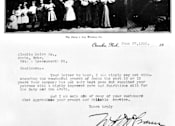 Thumbnail 4 of 8 - A black and white photo of a group of people with a letter below it.