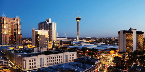 an aerial view of the city at sunset