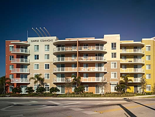 a rendering of an apartment building on the corner of a street