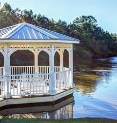 a gazebo on the water next to a lake  at Cape Landing, Myrtle Beach, 29588
