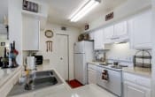 Thumbnail 14 of 20 - Kitchen model with white cabinets and white appliances
