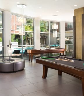Resident Lounge with Pool Table and Shuffle Board at The Grand at Upper Kirby | Apartments in Houston, TX