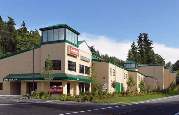 A large building with a red sign on it.