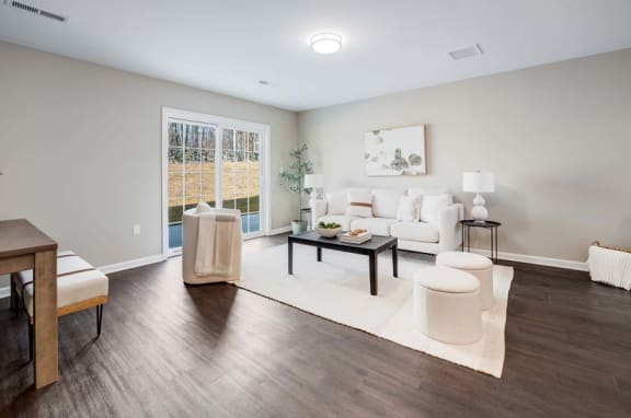 a living room with a couch and a table at Pleasant View Estates, Griswold, Connecticut