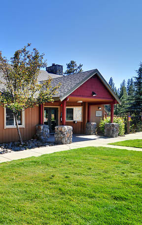 the front of the home with a sidewalk leading to the front door
