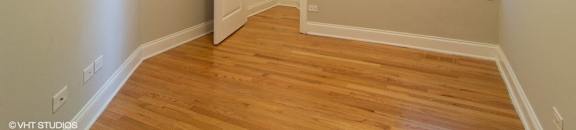 Bedroom with hardwood floors and a closet