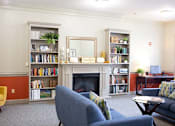 Thumbnail 1 of 6 - a living room filled with furniture and a fireplace