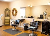 Thumbnail 4 of 6 - a barbershop with chairs and a counter in a nail salon