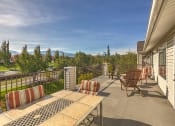 Thumbnail 15 of 16 - Balcony with seating area at VINTAGE AT Sequim Apartments, Washington