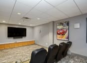 Thumbnail 14 of 21 - a small conference room with a flat screen tv and leather chairs at 3333 Wisconsin, Washington, Washington