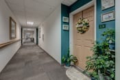 Thumbnail 10 of 16 - Hallway to apt doors Sequim WA 98382 Apts For rent l Vintage at Sequim Senior Apartments 