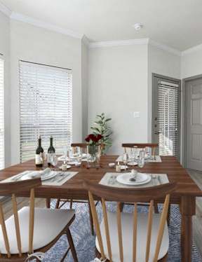 a kitchen and dining room with a wooden table and chairs