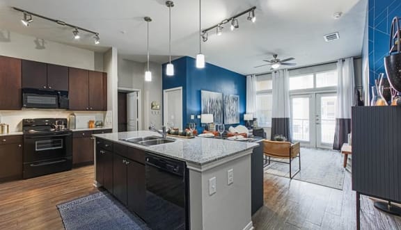 open-concept kitchen and living area at Aspire at 610 apartments