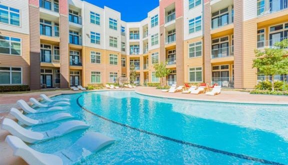 swimming pool with aqua sun shelf at Aspire at 610 apartments