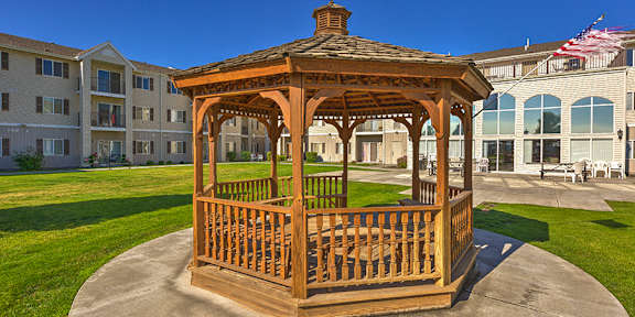 a gazebo in front of an apartment building  at VINTAGE AT RICHLAND Apartments, Richland , WA