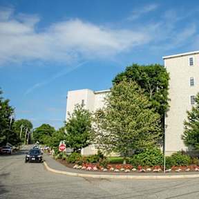 Large white building at Emerson Shoe Lofts Apartments, Rockland