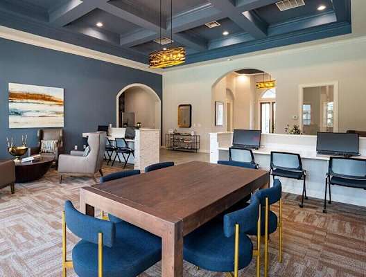 a large dining room with a table and chairs