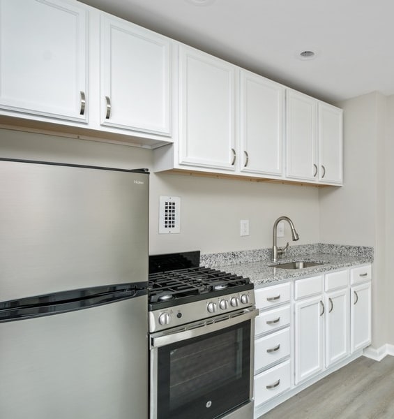 a kitchen at the district flats apartments in lenexa, ks