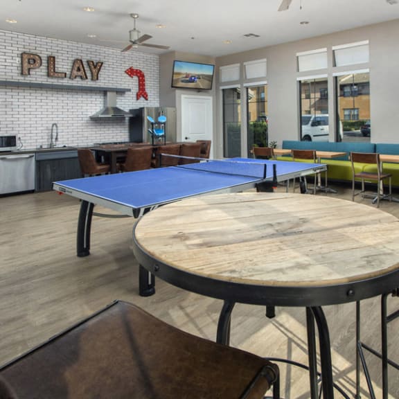 a game room with a ping pong table and a play area at The Reserve at 4S Ranch, California