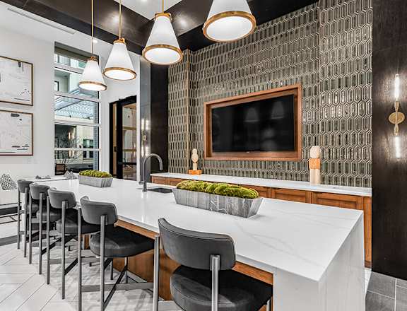 Community Clubhouse Kitchenette Area at Ovation at Galatyn Park Apartments located in Richardson, TX.