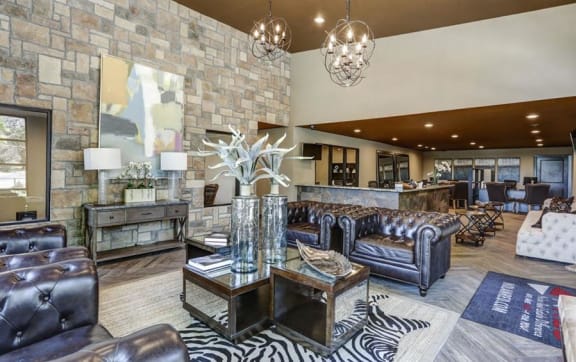 an open living room with a couch and a door to a balcony at The Boulevard, Roeland Park, KS, 66205