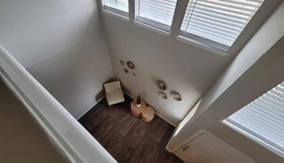 an overhead view of a room with a chair and a vase at Ivy Plains at Brooks Apartments, San Antonio