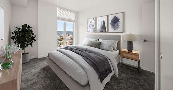 a bedroom with a bed and a window at Grand and Linden Family Apartments, South San Francisco