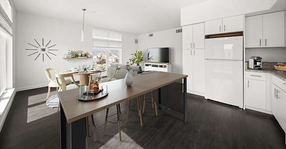 a kitchen and dining area with a table and chairs at Grand and Linden Family Apartments, South San Francisco