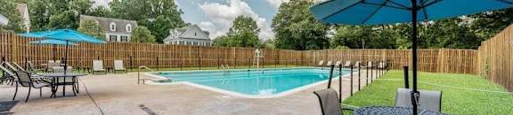 Outdoor Pool with Lounges and Tables