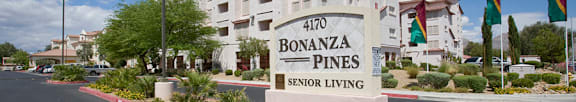 A large building with a parking lot in front of it.