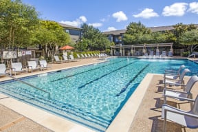 Austin Apartments - Expansive Swimming Pool Surrounded By Various Lounge Chairs