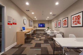 Business center with desk and seating l The Parc at Pruneyard Apartments