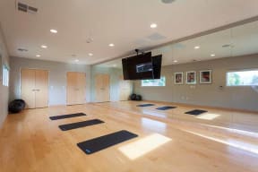 Studio with yoga mats l The Parc at Pruneyard Apartments