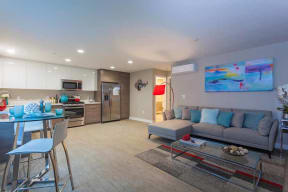 Living room and kitchen l The Parc at Pruneyard Apartments