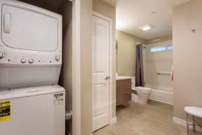 Apartments Campbell-Parc at Pruneyard Bathroom with Large Tub with Washer and Dryer Right Outside