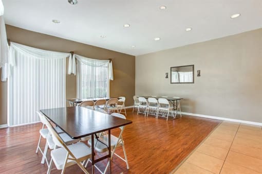 Clubhouse with table and chairs on hardwood style flooring