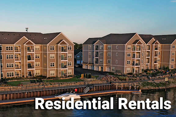 A large building complex with the words "Residential Rentals" written across the top.