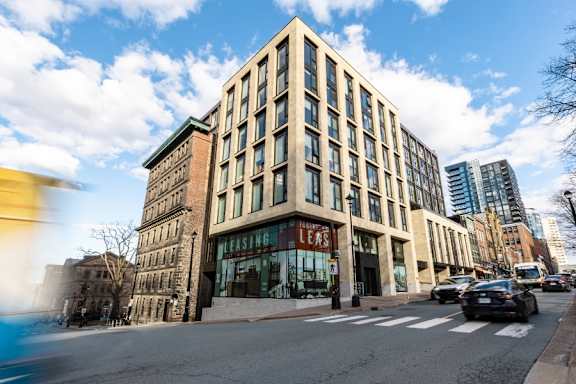 A modern building with the word "LEASING" on the front.