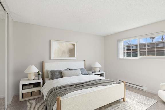 Model Bedroom with Carpet and Window View at Los Gatos Landing Apartments located in San Jose, CA-SMLAM.