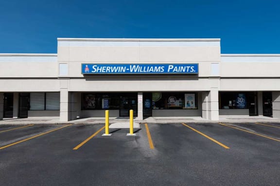 a building with a sign that says sherwin williams paints
