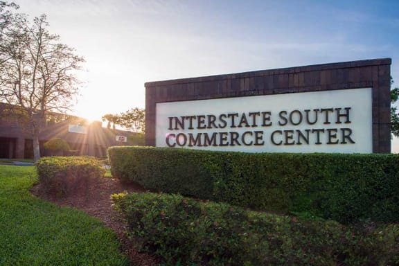 a sign for the interstate south commerce center