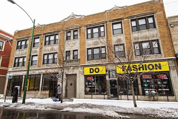 the facade of a building with a yellow do do shop sign
