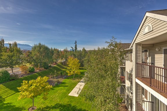 View of grass from balcony at VINTAGE AT Sequim Apartments, Washington
