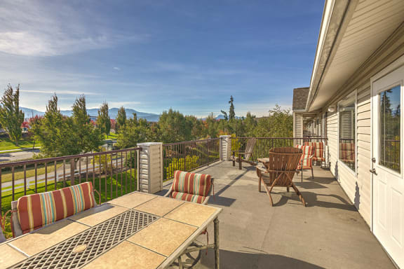 Balcony with seating area at VINTAGE AT Sequim Apartments, Washington