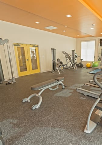 the gym at Midtown Sam Houston Apartments, Huntsville, TX, 77340