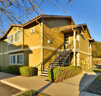 A two-story house with a staircase leading to the second floor.