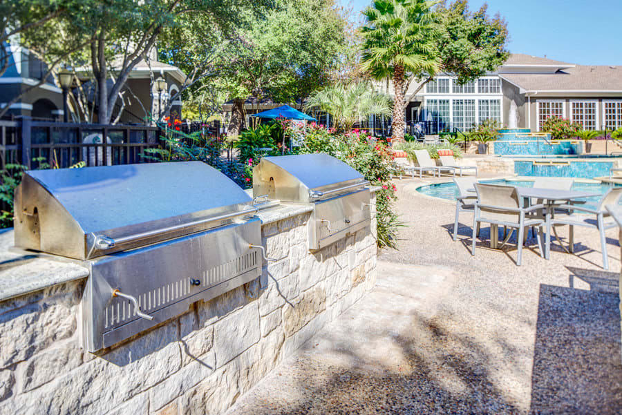 Nolina Flats charcoal BBQ pits and outdoor seating - Austin, TX