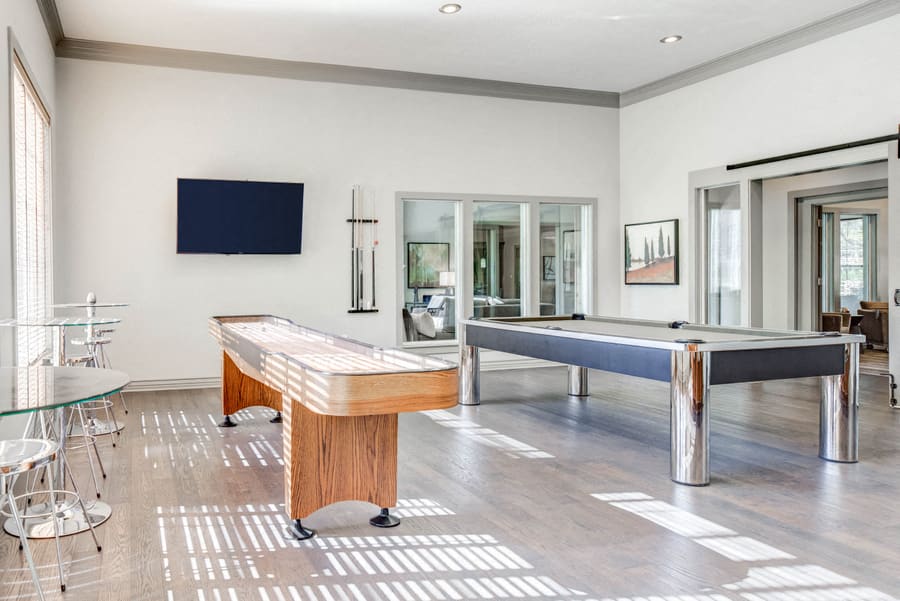 Nolina Flats game lounge with shuffleboard and pool table - Austin, TX